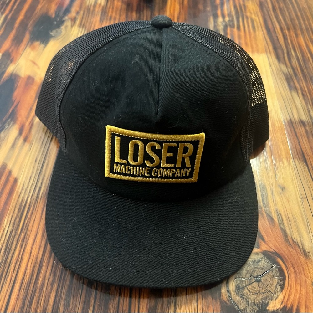 Loser Machine Company Patch Black Trucker hat.